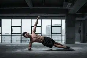 Man on HGH after exercising in a gray room